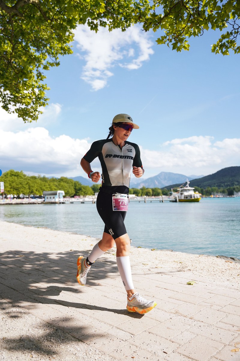 Lauren Nash racing the run leg of an Ironman in UP Dietitian kit